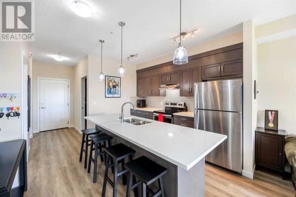 Photo 3 - Kitchen - 309, 30 Shawnee Common SW, Calgary, AB T2Y0R1