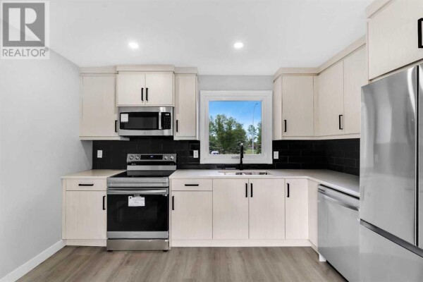 Photo 2 - Kitchen - 3869 Fonda Way SE, Calgary, AB T2A5R4