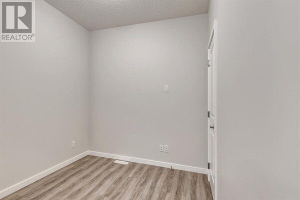 Photo 3 at 179 Wolf River Drive, Calgary, AB T2X0M7