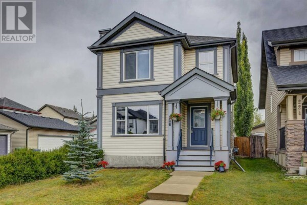 Photo 1 - FrontYard - 228 Sunset Heights, Cochrane, AB T4C0E1