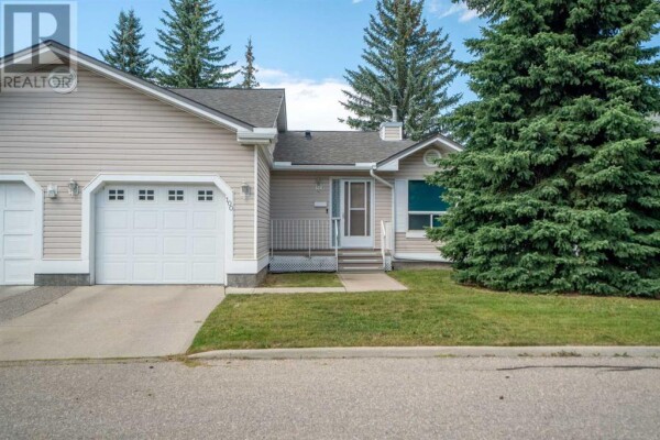 Photo 1 - FrontYard - 100 Deer Ridge Close SE, Calgary, AB T2J7C2