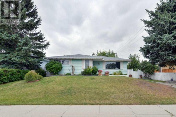 Photo 1 at 7035 Huntercrest Road NW, Calgary, AB T2K4J9