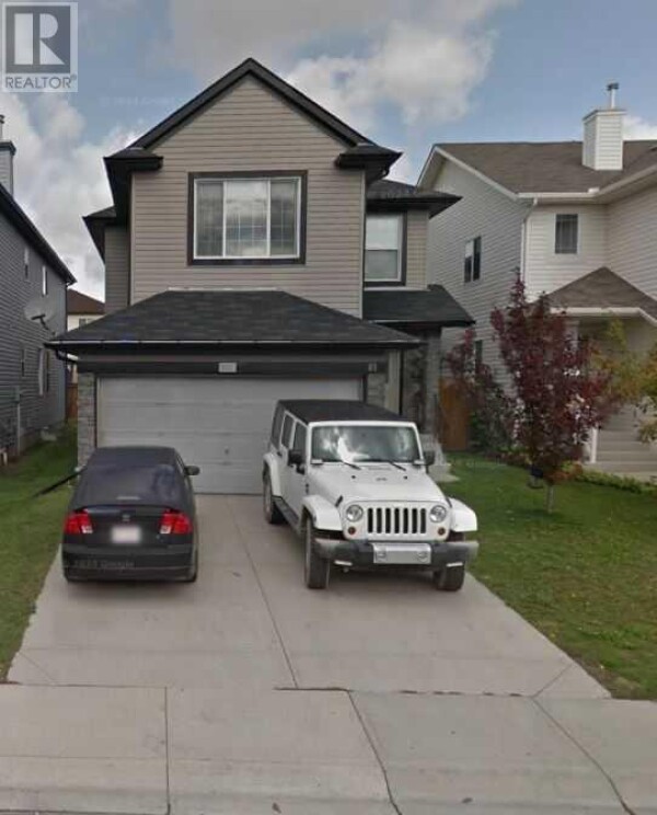 Photo 1 - FrontYard - 81 Saddlecrest Green NE, Calgary, AB T3J5N4