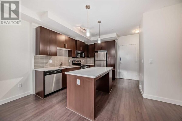 Photo 1 - Kitchen - 112, 15233 1 Street SE, Calgary, AB T2X0X7