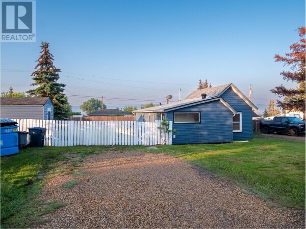 Photo 1 - Backyard - 1005 95 Avenue, Dawson Creek, BC V1G1H9