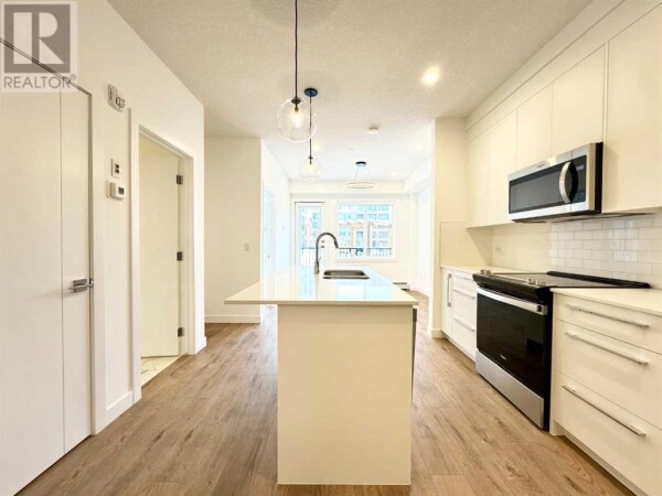 Photo 2 - Kitchen - 2101, 111 Wolf Creek Drive SE, Calgary, AB T2X5X2