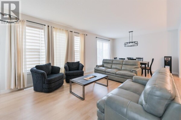 Photo 2 - LivingRoom - 153 Cranbrook Cove SE, Calgary, AB T3M2S9