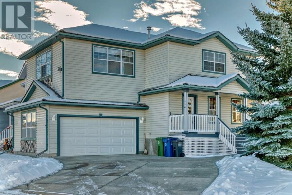 Photo 2 - FrontYard - 114 Bow Ridge Crescent, Cochrane, AB T4C1V2